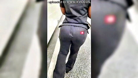 Thick ebony nurse in tight scrubs, highlighting her big round ass from behind