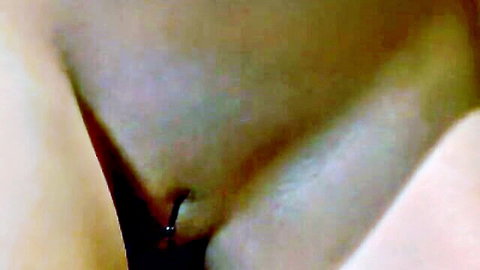 Close-up of Jada's pierced pussy dominated by Nyomi in BDSM