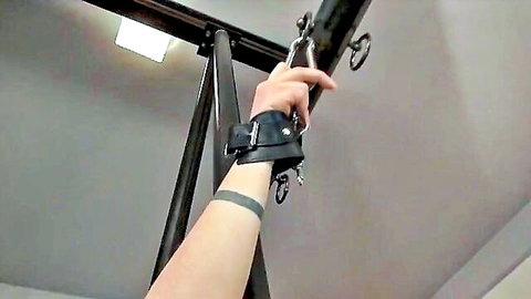 Bridgette Monroe bound in leather cuffs and chains for lesbian caning humiliation