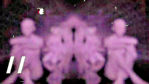Blurry purple silhouette of two dominant women in lezdom humiliation scene