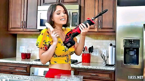Krissy Lynn teasing with power tool and banana in sexy kitchen outfit