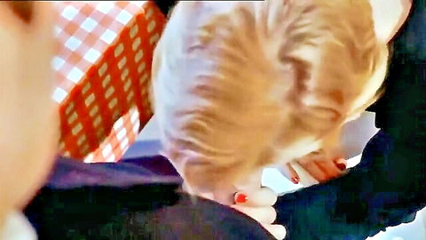 Brigitte Lahaie blonde giving blowjob under table in vintage scene