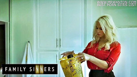 Blonde MILF London River in red blouse holding bag in kitchen tease
