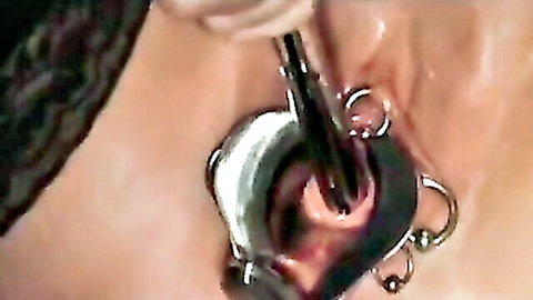 Granny close-up with speculum insertion and labia piercings
