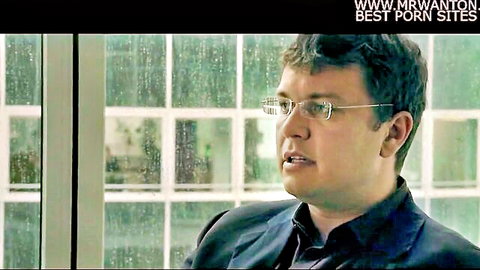 Man in glasses and suit in office interview from Pornocratie documentary
