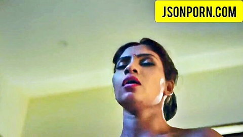 Aroused Punjabi girl with intense expression and parted lips in suhagraat scene