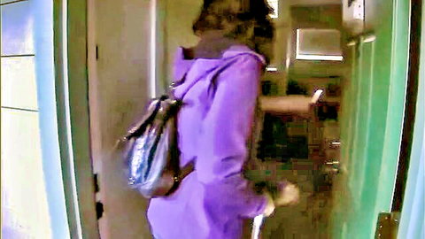 Zoey Holloway in purple jacket and backpack on vacation