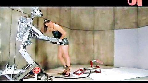 Brunette in latex riding FuckZilla sex machine
