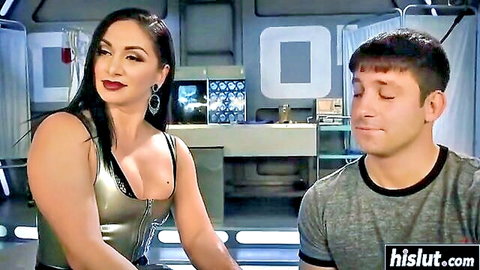 Lea Lexis as dominant brunette in shiny top leans over submissive man