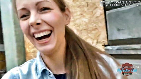 Smiling blonde woman in denim jacket, mature amateur tease