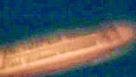 Blurry orange glowing streak on dark blue abstract background