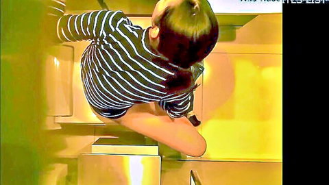Japanese babe in striped shirt squats in bathroom spreading shaved pussy for solo masturbation