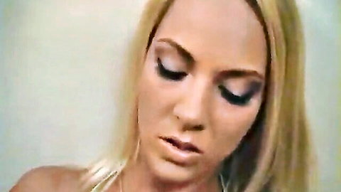 Seductive blonde MILF Lita Chase close-up, lips parted in tease