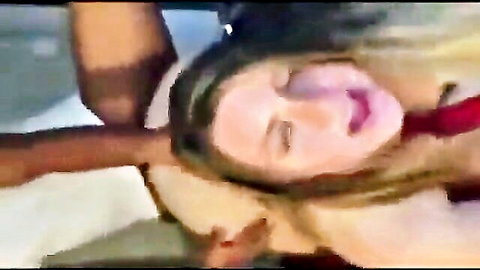 Blonde woman in cuck humiliation, mouth open wide, gripped by dark hands