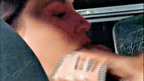 Blurry closeup of brunette deepthroating cock in car backseat