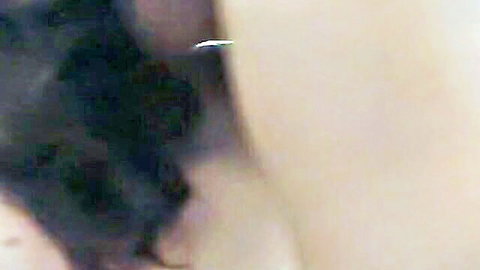 Blurry Chinese couple in intimate bathroom scene, amateur style