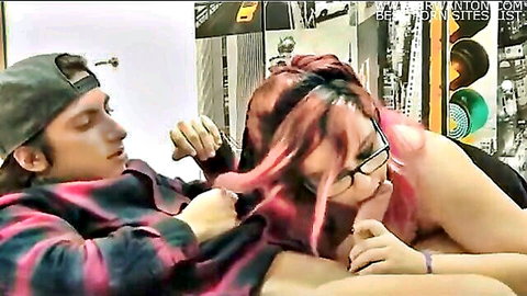 Pink-haired teen with glasses gives blowjob to friend in casual plaid shirt