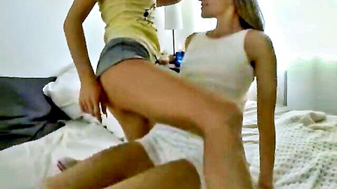 Blonde lesbian fingers wet pussy of girlfriend on bed in homemade video