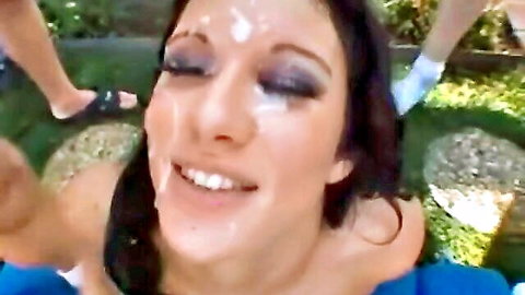 Smiling brunette with facial cumshot in outdoor scene