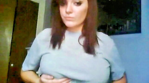 Pretty brunette with huge tits in tight gray t-shirt, teasing solo pose