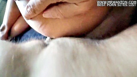 Extreme close-up of hairy pussy overflowing with cum