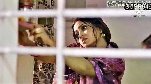 Sexy Desi woman in purple saree peeking through window, teasing gaze