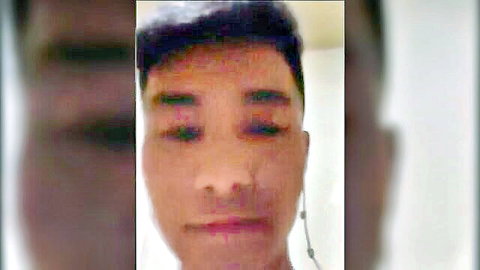 Blurry close-up of attractive young Chinese man's face in jerk-off video thumbnail