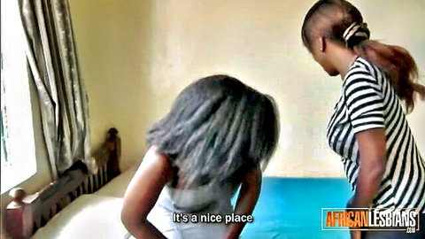 Amateur busty African lesbians in intimate bedroom encounter