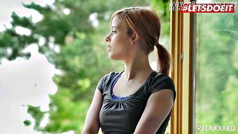 Ria Sunn, Czech redhead in tank top gazing out window, kinky pool tease