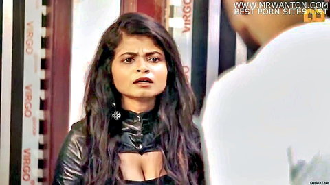 Surprised Indian babe with deep cleavage in black leather jacket facing guy in episode