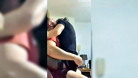 Amateur mature couple passionately hugging and kissing in bedroom