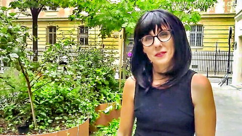 French MILF Marie smiling in black dress outdoors