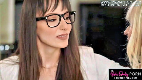 Brunette wedding planner in glasses slides hand up blonde bride's dress in intimate lesbian moment