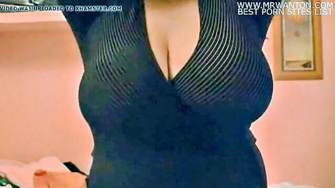 Mariajo in sexy black dress with deep cleavage, homemade amateur tease