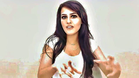 Seductive Hyderabad escort with long dark hair in white top, gesturing invitingly