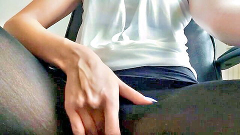 Slim woman rips pantyhose and rubs pussy at desk