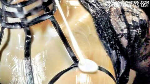 Woman in black harness lingerie with cum dripping on face and neck after deepthroat blowjob