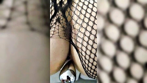 Wife's big ass in fishnet stockings with silver butt plug after spanking