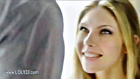 Blonde beauty smiling intimately with man in erotic Babes scene