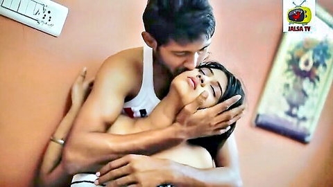 Indian couple in passionate embrace and neck kissing