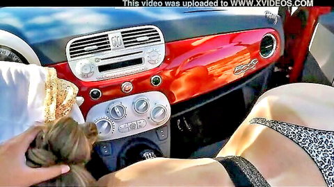 Blonde in leopard bikini pumping solo in red Fiat outdoors