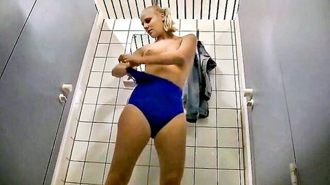 Topless blonde with big ass bends over pulling up tight blue thong in locker room shower