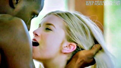 Blonde woman in passionate interracial embrace with black man