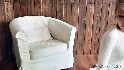 Blonde sexy kitten in white outfit teases in BDSM style with buttplug