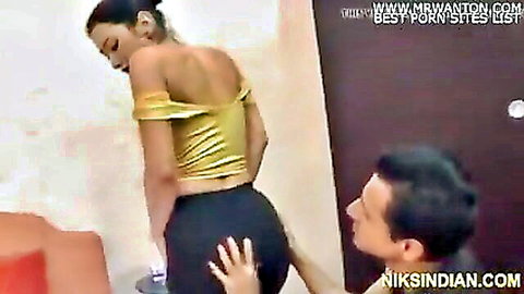 Sexy Indian babe in yellow top bends over as guy grabs her fat ass in tight black pants