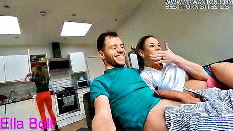 Blonde gives risky blowjob on sofa while redhead friend cooks nearby