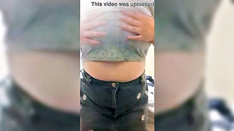 Curvy amateur squeezes big tits through wet see-through gray shirt