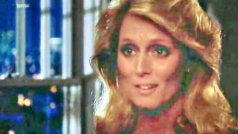 Judith Baldwin blonde actress in elegant dress, seductive smile 1984