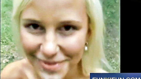 Closeup of smiling blonde woman with pearl earrings and seductive eyes
