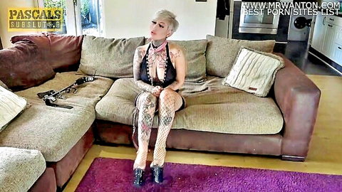 Tattooed Pixi Peach in black lingerie, fishnets and heels, BDSM tease